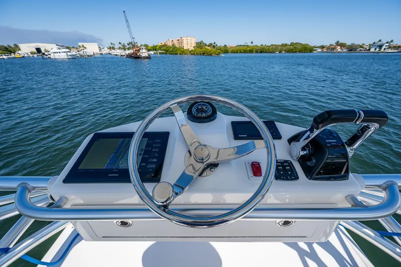 Slide: The Image of 2018 Albemarle 290 Express Fisherman helm with Garmin navigation and Yamaha controls. - 41