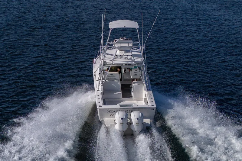 Slide: The Image of 2018 Albemarle 290 Express Fisherman cruising on open water, rear view. - 6