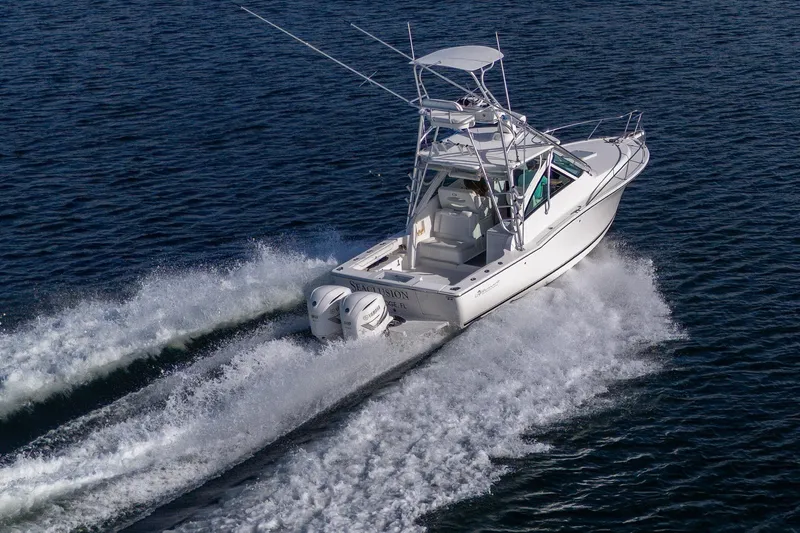 Slide: The Image of 2018 Albemarle 290 Express Fisherman cruising on open water, showcasing powerful twin engines. - 8