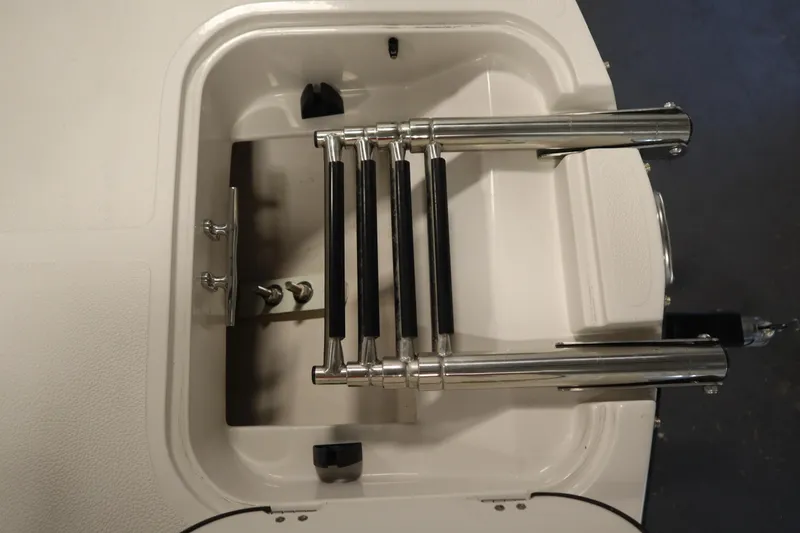 Slide: The Image of 2017 Starcraft 221 STARSTEP boat ladder, stainless steel, folded in storage compartment. - 12
