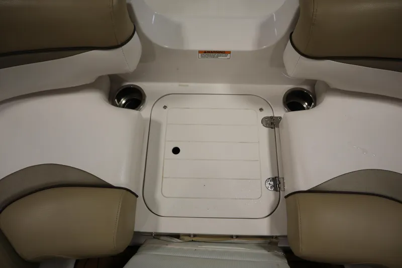 Slide: The Image of 2017 Starcraft 221 STARSTEP boat seating area with cup holders and storage compartment. - 14