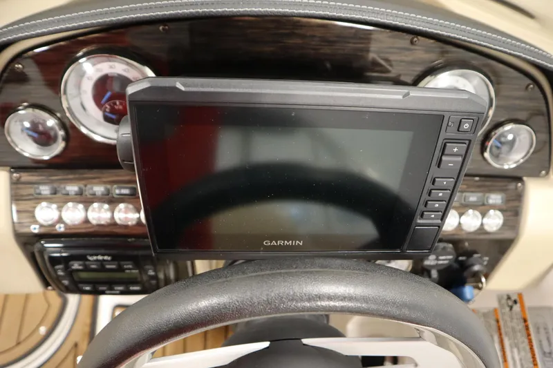 Slide: The Image of 2017 Starcraft 221 STARSTEP dashboard with Garmin navigation system and control panel. - 26