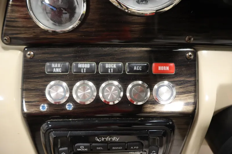 Slide: The Image of Control panel of 2017 Starcraft 221 STARSTEP boat with various switches and dials. - 27