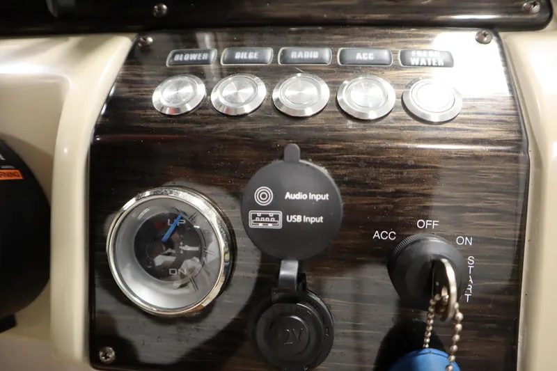 Slide: The Image of Control panel of 2017 Starcraft 221 STARSTEP boat with switches and audio input. - 30