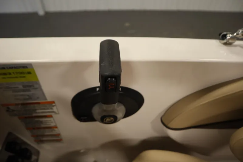 Slide: The Image of 2017 Starcraft 221 STARSTEP boat throttle control and seating area. - 32