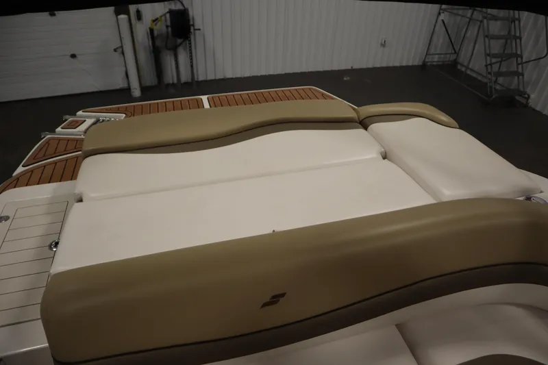 Slide: The Image of 2017 Starcraft 221 STARSTEP boat interior with beige seating and wood accents. - 44