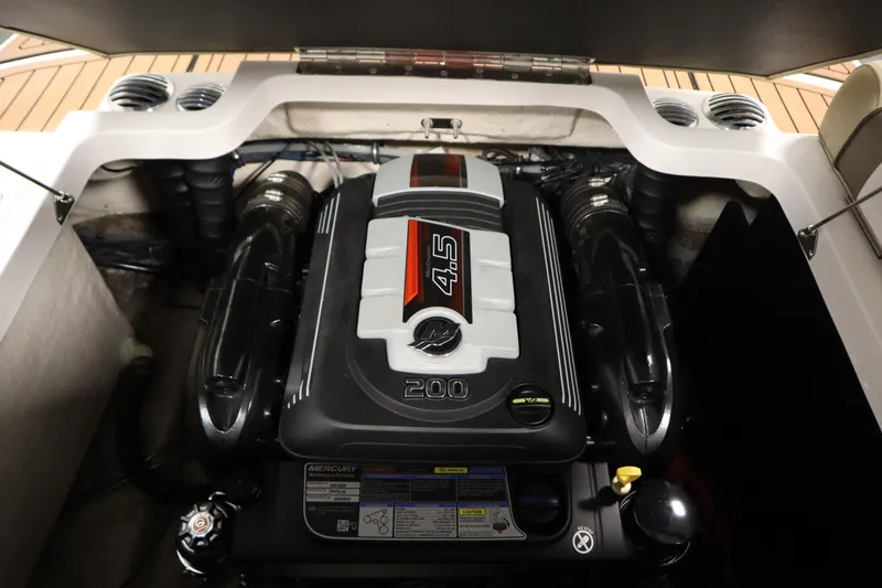 Slide: The Image of Engine compartment of a 2017 Starcraft 221 STARSTEP boat, featuring a 4.5L Mercury engine. - 45