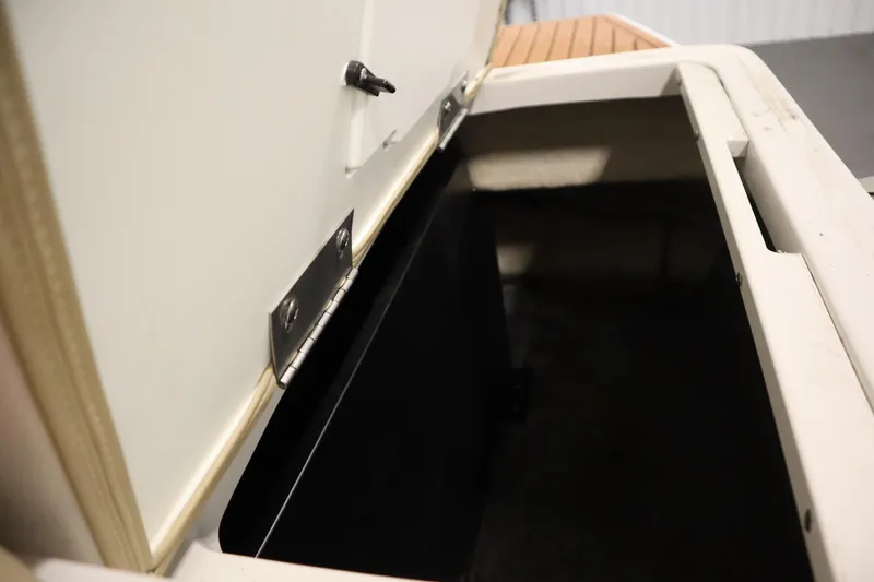 Slide: The Image of Open storage compartment in 2017 Starcraft 221 STARSTEP boat, showcasing interior space. - 46