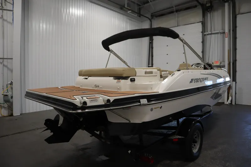Slide: The Image of 2017 Starcraft 221 STARSTEP boat in indoor storage, rear view. - 5