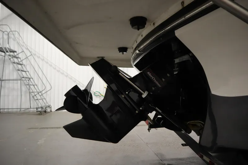 Slide: The Image of 2017 Starcraft 221 STARSTEP boat with MerCruiser engine in a garage setting. - 53