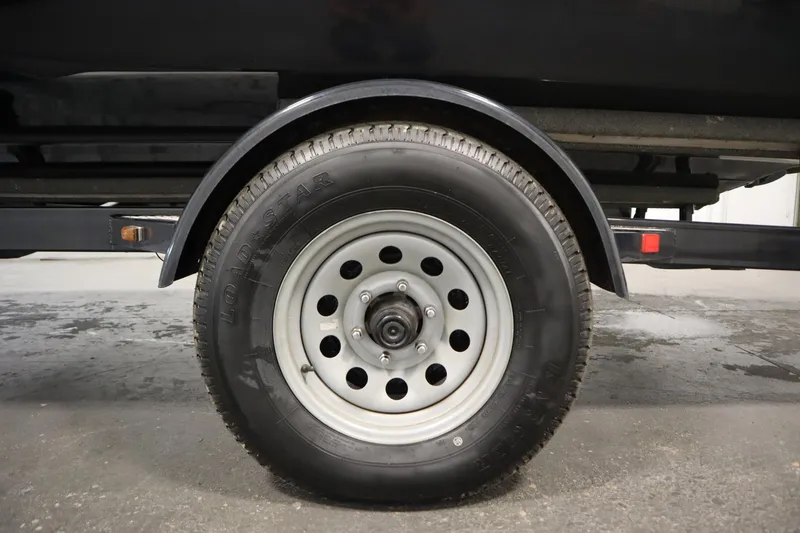 Slide: The Image of 2017 Starcraft 221 STARSTEP trailer wheel, close-up view on concrete surface. - 57