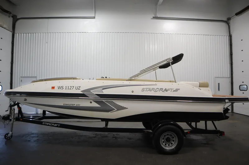 Slide: The Image of 2017 Starcraft 221 Starstep boat on trailer in indoor storage. - 8