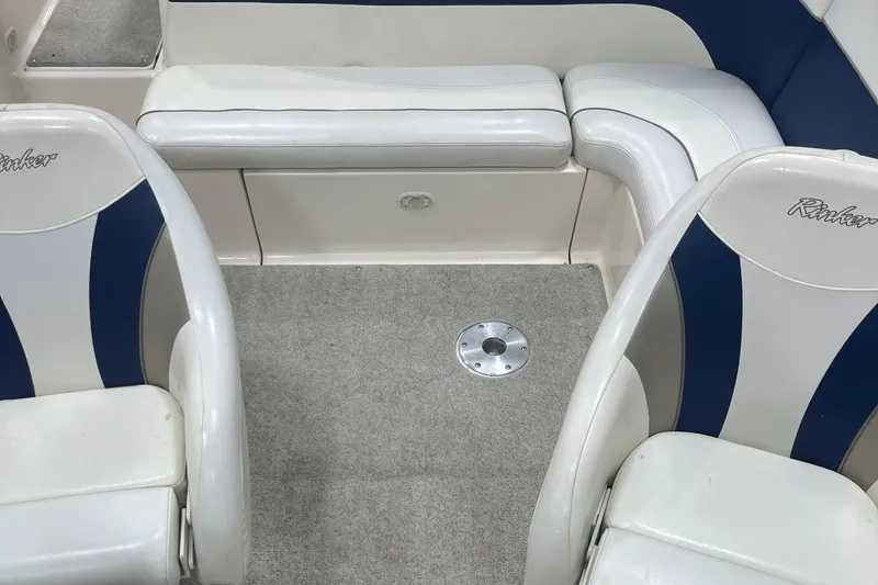 Slide: The Image of Interior of a 2000 Rinker 212 Captiva Bowrider with white and blue seating. - 15