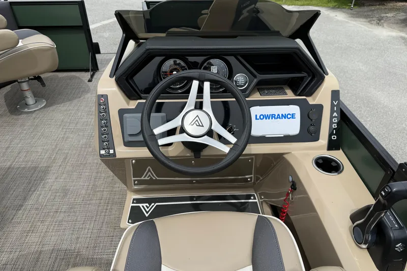 Slide: The Image of 2024 Viaggio 18 FISH boat dashboard with steering wheel and Lowrance display. - 10