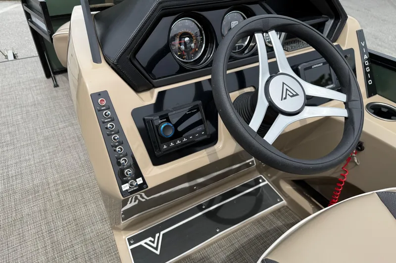 Slide: The Image of 2024 Viaggio 18 FISH boat dashboard with steering wheel and control panel. - 13