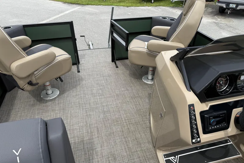 Slide: The Image of 2024 Viaggio 18 FISH boat interior with beige seats and modern dashboard. - 14
