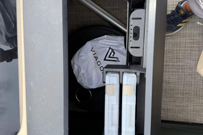 Slide: The Image of 2024 Viaggio 18 FISH boat interior with storage compartments and accessories. - 16