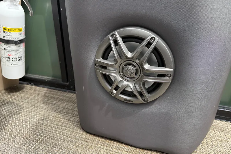 Slide: The Image of Speaker and fire extinguisher on Viaggio 18 FISH 2024 boat interior. - 18