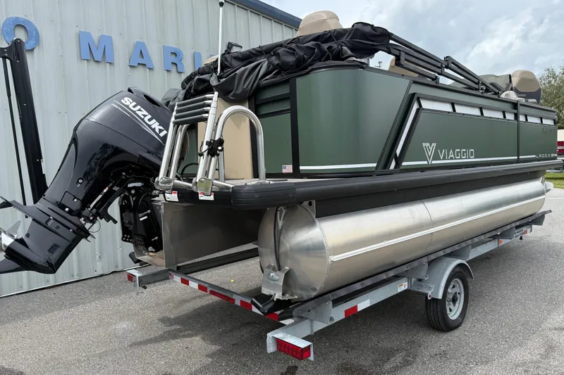 Slide: The Image of 2024 Viaggio 18 FISH pontoon boat with Suzuki outboard motor on trailer. - 20
