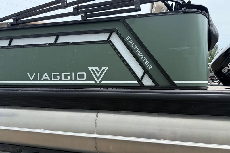 Slide: The Image of 2024 Viaggio 18 FISH saltwater boat, green exterior with logo and design details. - 4