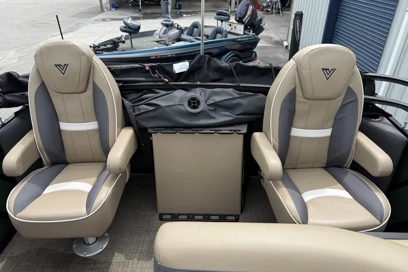 Slide: The Image of 2024 Viaggio 18 FISH boat interior with two beige and gray seats. - 8