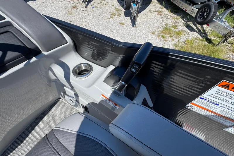Slide: The Image of Interior of 2021 Bennington 25 RTSB boat with control lever and cup holder. - 23