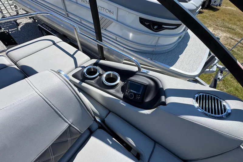 Slide: The Image of 2021 Bennington 25 RTSB boat interior with cup holders and control panel. - 30