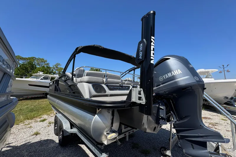 Slide: The Image of 2021 Bennington 25 RTSB pontoon boat with Yamaha engine on trailer. - 9