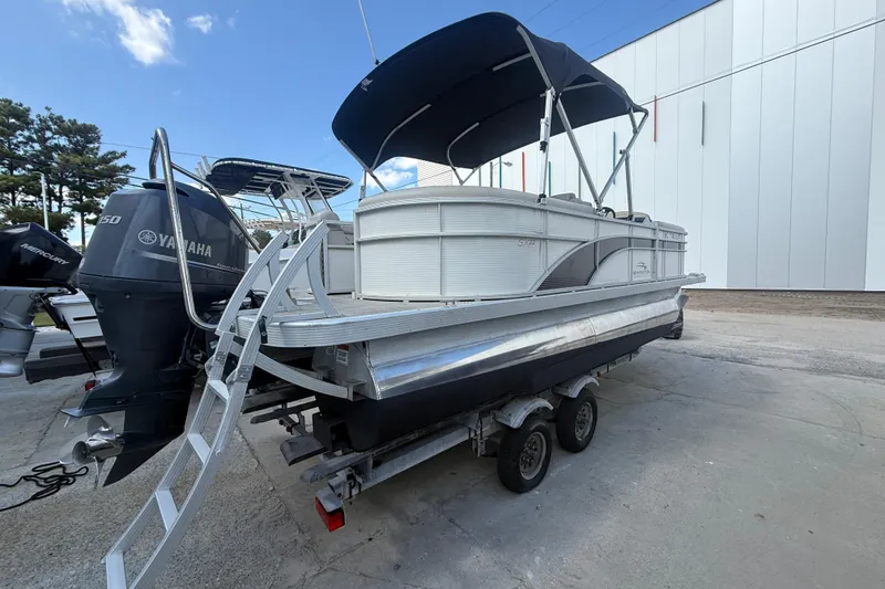 Slide: The Image of 2016 Bennington 22 SSRX pontoon boat on trailer with Yamaha outboard motor. - 28