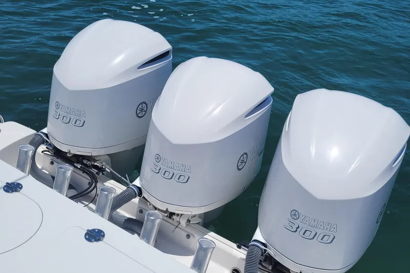 Slide: The Image of Triple Yamaha 300 outboard engines on 2018 Everglades 355 Center Console boat. - 13