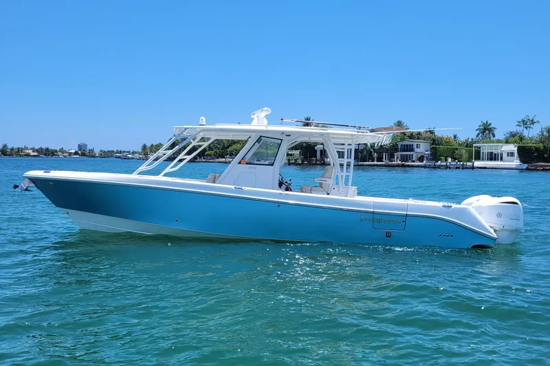 Slide: The Image of 2018 Everglades 355 Center Console boat on clear blue water, sunny day. - 2