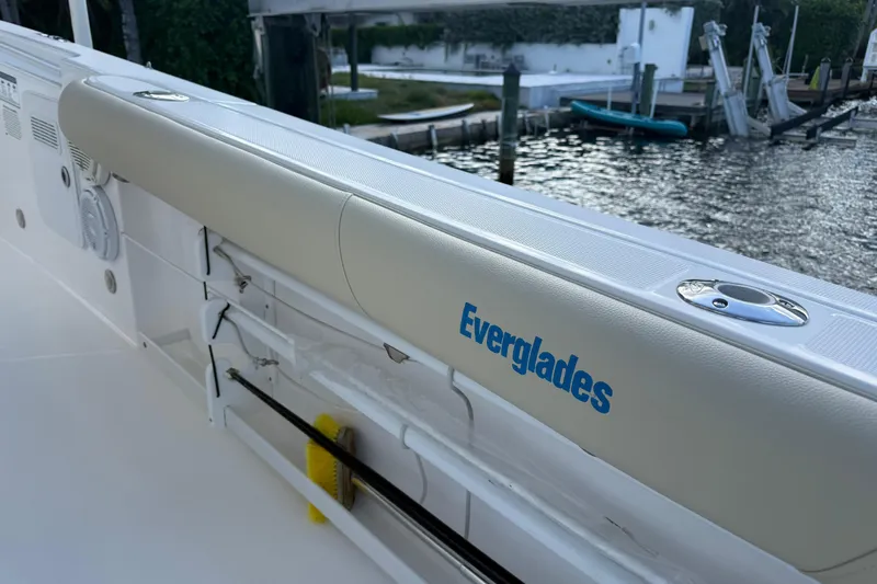 Slide: The Image of 2018 Everglades 355 Center Console boat docked by the water. - 20