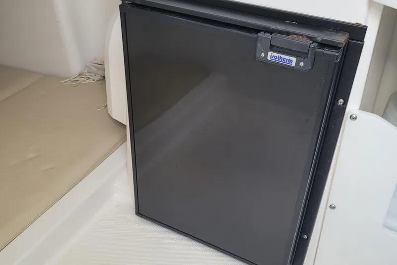 Slide: The Image of Compact Isotherm fridge inside 2018 Everglades 355 Center Console boat cabin. - 28
