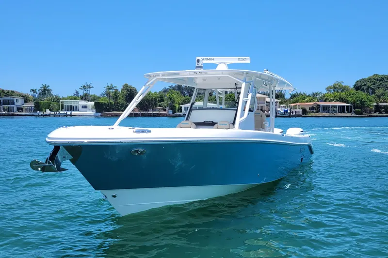 Slide: The Image of 2018 Everglades 355 Center Console boat on clear blue water, sunny day. - 3