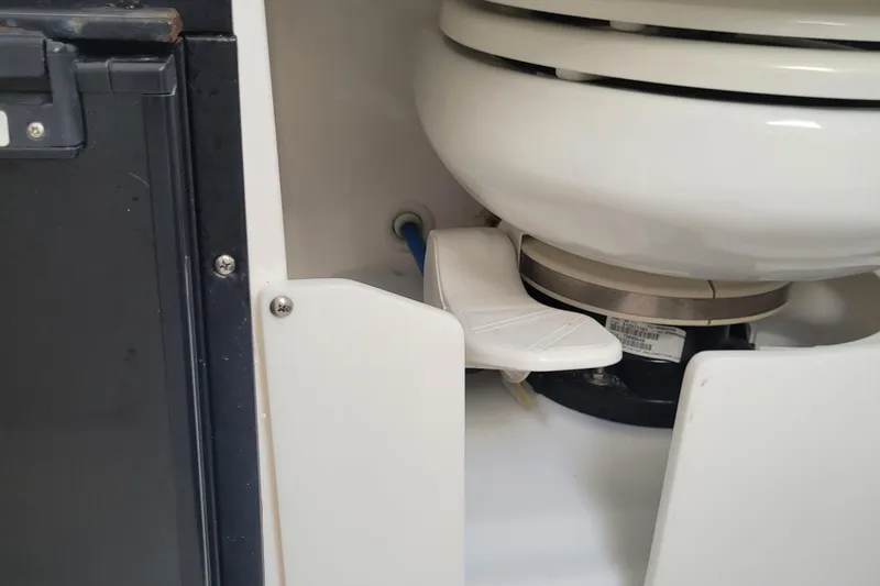 Slide: The Image of 2018 Everglades 355 Center Console marine toilet detail with foot pedal. - 30