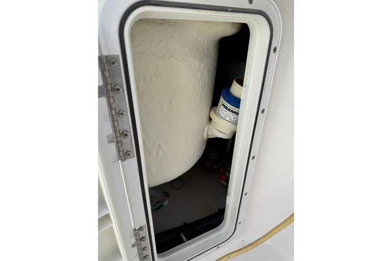 Slide: The Image of Open hatch on 2018 Everglades 355 Center Console boat, showing interior components. - 31