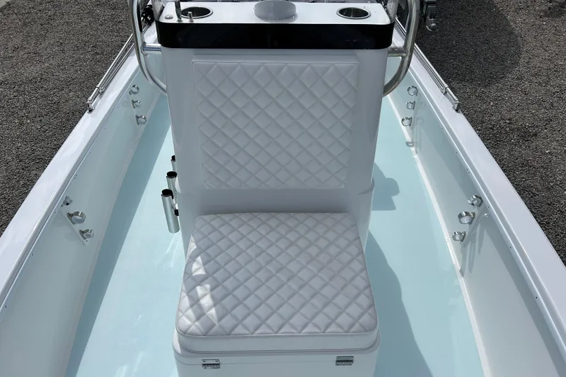 Slide: The Image of 2025 Dragonfly Boatworks Spanish Wells 21 with quilted white seating and sleek design. - 12