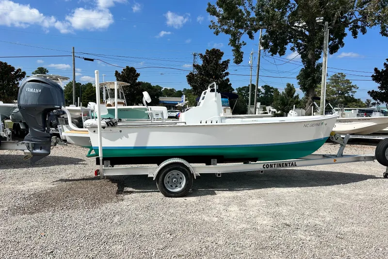 Slide: The Image of 2025 Dragonfly Boatworks Spanish Wells 21 on trailer, featuring Yamaha outboard motor. - 4