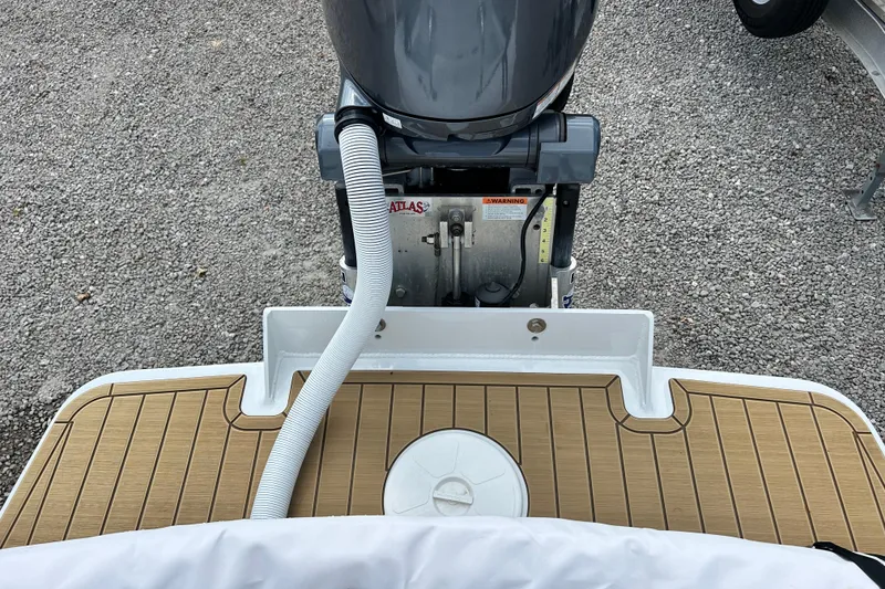 Slide: The Image of 2025 Dragonfly Boatworks Spanish Wells 21 motor and deck detail. - 9