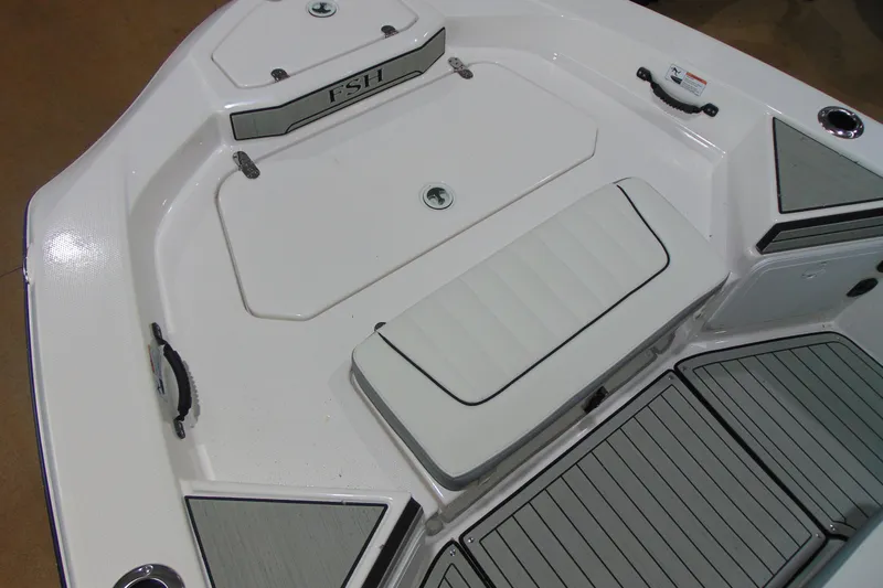 Slide: The Image of 2026 Yamaha Boats 195 FSH Sport deck, featuring sleek seating and storage compartments. - 11