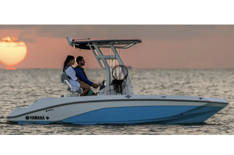 Slide: The Image of 2026 Yamaha Boats 195 FSH Sport displayed indoors on a trailer. - 3