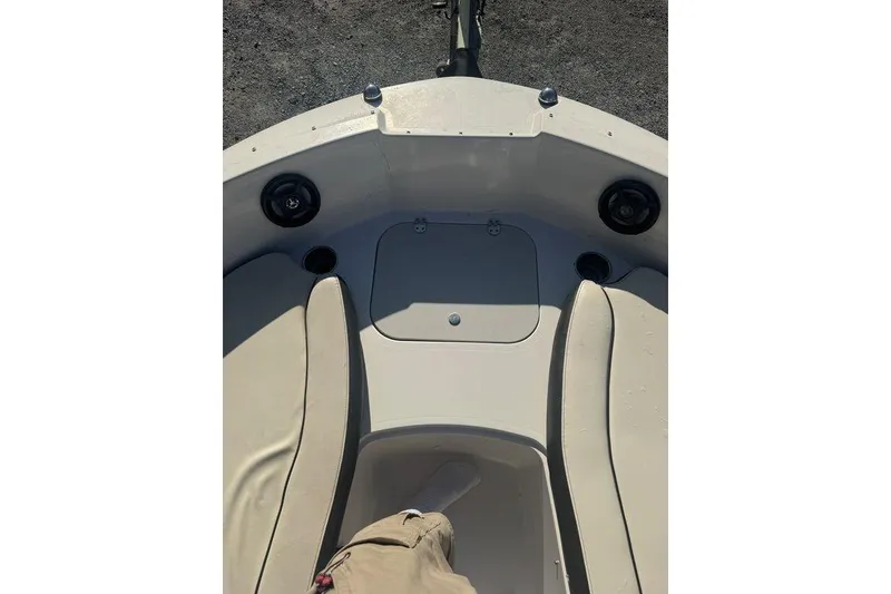Slide: The Image of 2016 Stingray 191DC (OB) boat interior with seating and storage compartment. - 10
