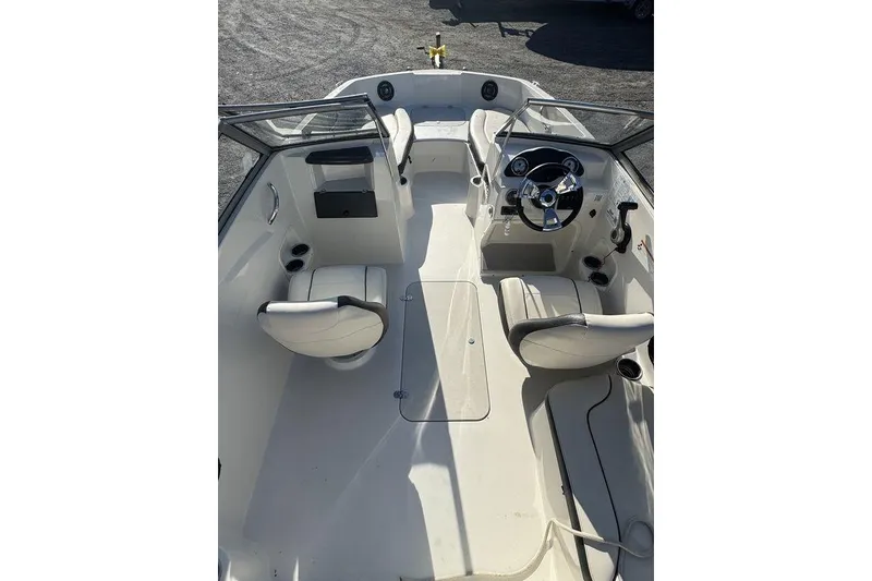 Slide: The Image of 2016 Stingray 191DC (OB) boat interior with dual seating and steering console. - 20