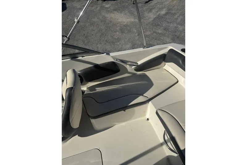 Slide: The Image of 2016 Stingray 191DC (OB) boat interior with seating and storage compartments. - 4