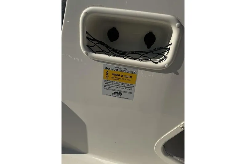 Slide: The Image of 2016 Stingray 191DC (OB) boat capacity label, maximum 9 persons or 1237 lbs. - 7