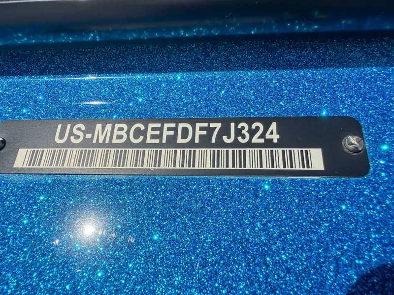 Slide: The Image of 2024 MasterCraft XT25 serial number on blue glitter background. - 24