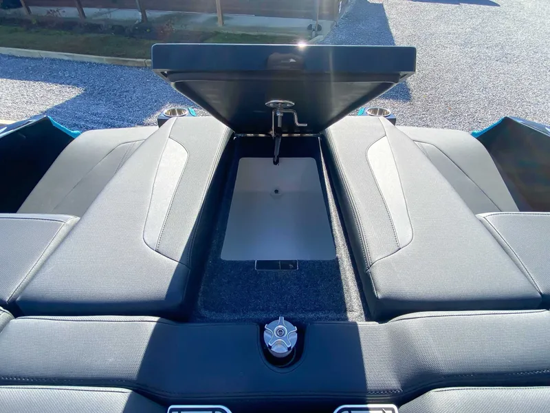 Slide: The Image of 2024 MasterCraft XStarS boat with open storage compartment lid. - 20
