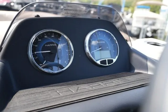 Slide: The Image of Dashboard of 2026 Harris Cruiser 210 boat with speedometer and digital display. - 12