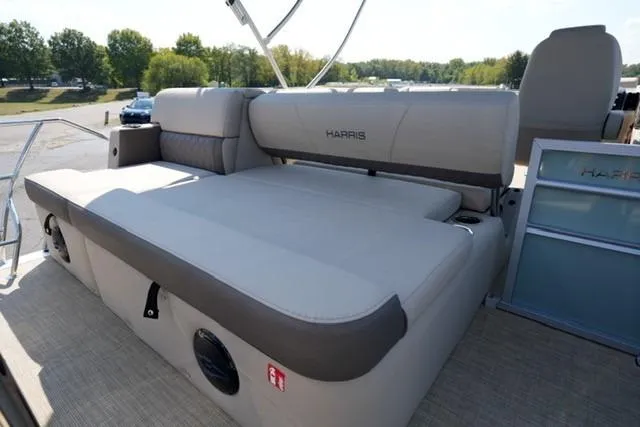 Slide: The Image of 2026 Harris Cruiser 210 boat interior with spacious seating and modern design. - 14