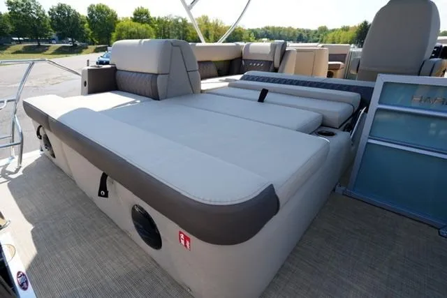 Slide: The Image of 2026 Harris Cruiser 210 boat interior with spacious seating and modern design. - 16